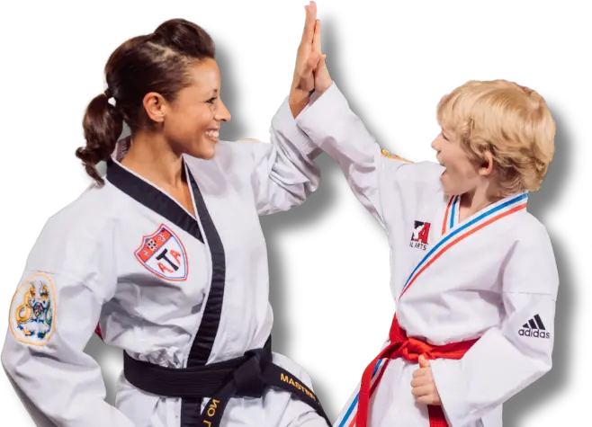 Martial arts student doing a high five with instructor