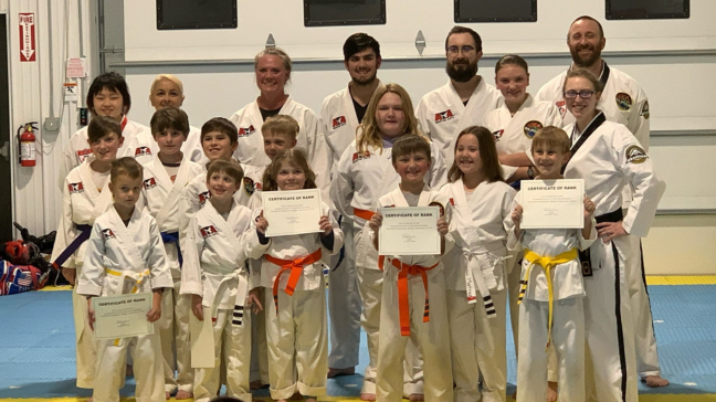 Group of children posing for a martial arts class photo
