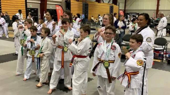 Martial arts student posing in a group picture