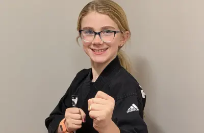 Student doing martial arts pose